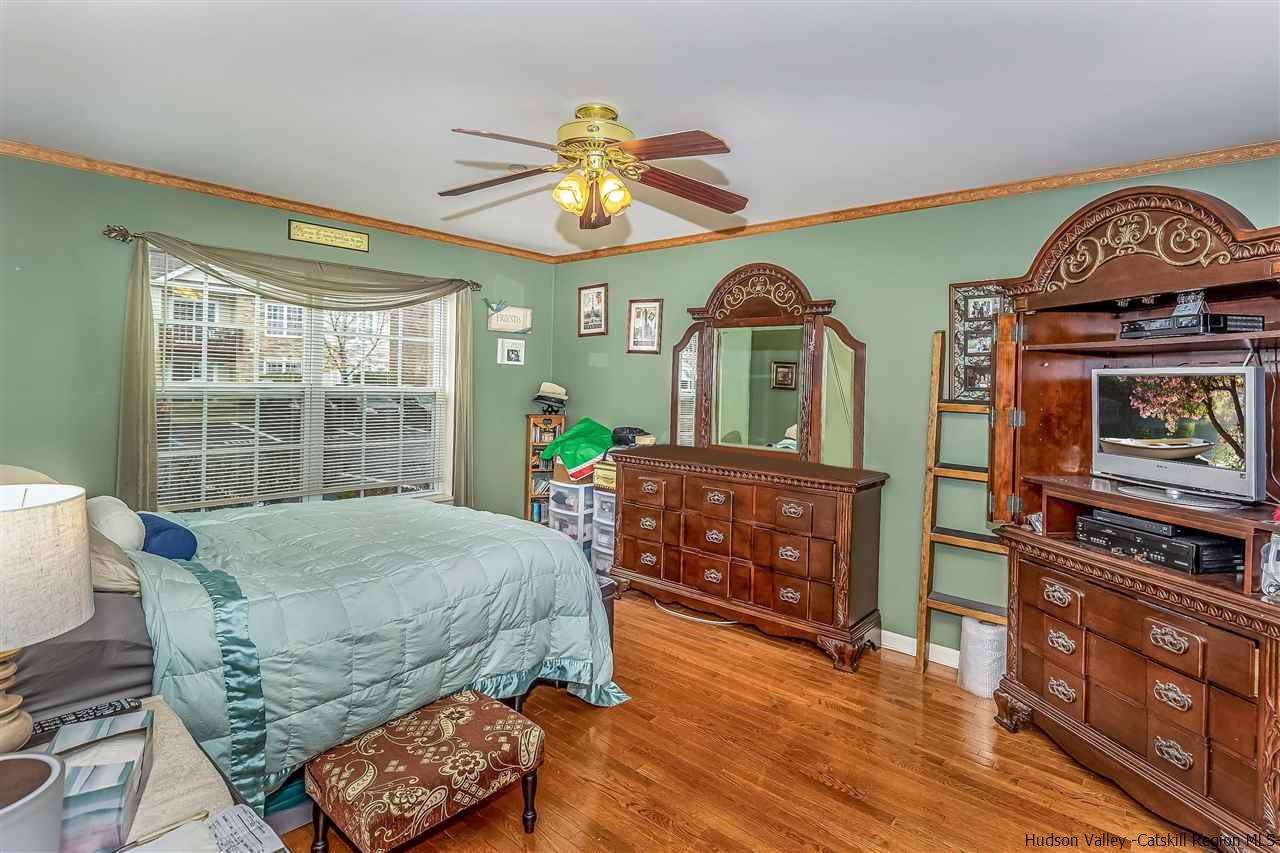 1129 Maggie Road Newburgh, NY 12550 - Photo 13 of 28 a living room with furniture and a dresser