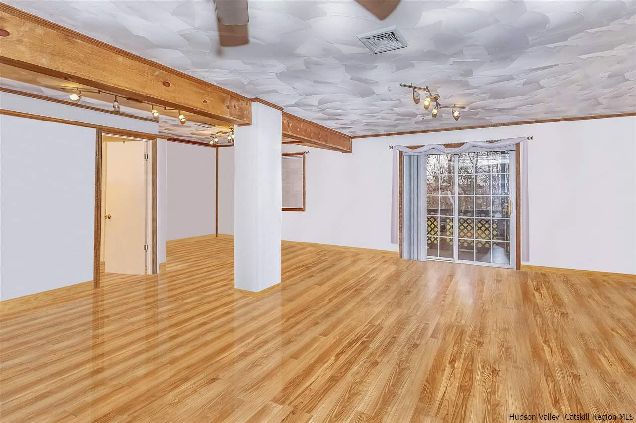 1129 Maggie Road Newburgh, NY 12550 - Photo 21 of 28 a view of an empty room with wooden floor and a window