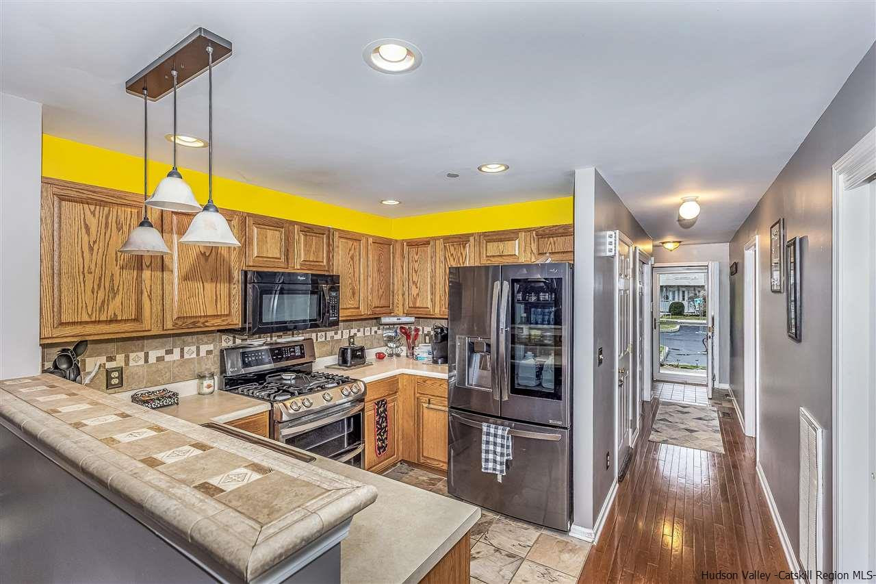 1129 Maggie Road Newburgh, NY 12550 - Photo 10 of 28 a kitchen with stainless steel appliances a sink stove and refrigerator