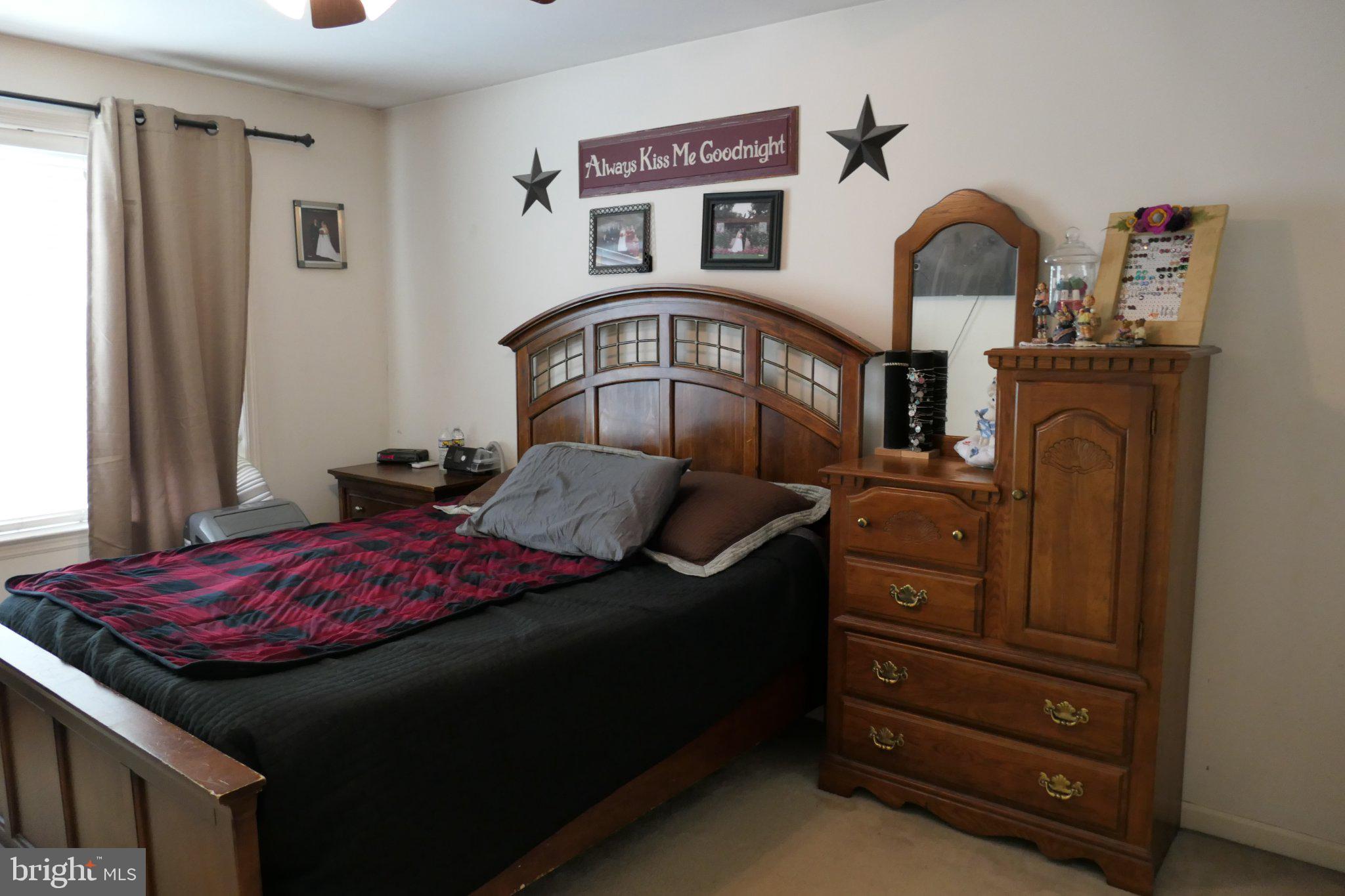 178 Riders Way Lebanon, PA 17042 - Photo 11 of 24 Cozy bedroom with warm wooden accents.