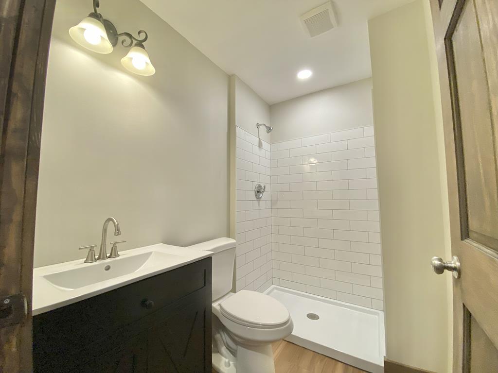372 Angelico Ridge Murphy, NC 28906 - Photo 39 of 40 a bathroom with a sink toilet and shower