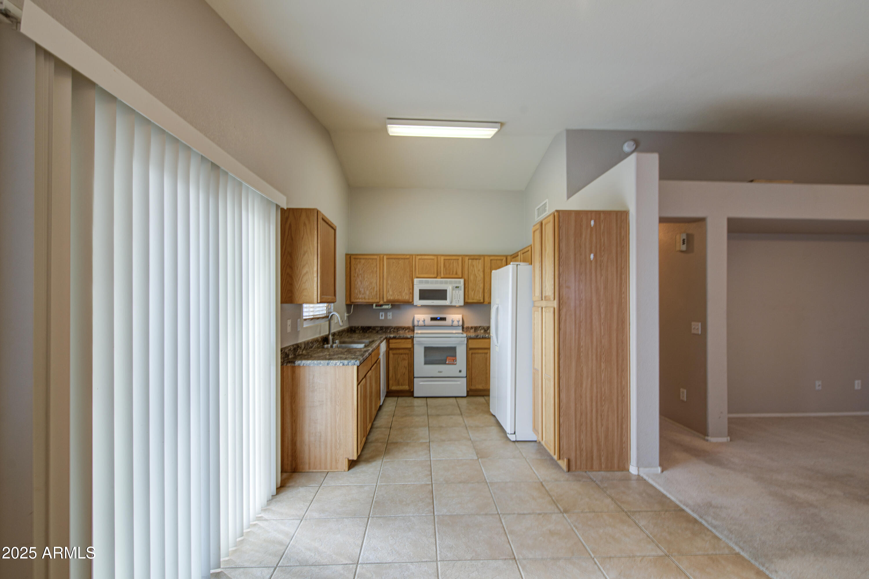 11465 East Cicero Street Mesa, AZ 85207 - Photo 12 of 36 a kitchen with stainless steel appliances granite countertop a refrigerator and a sink