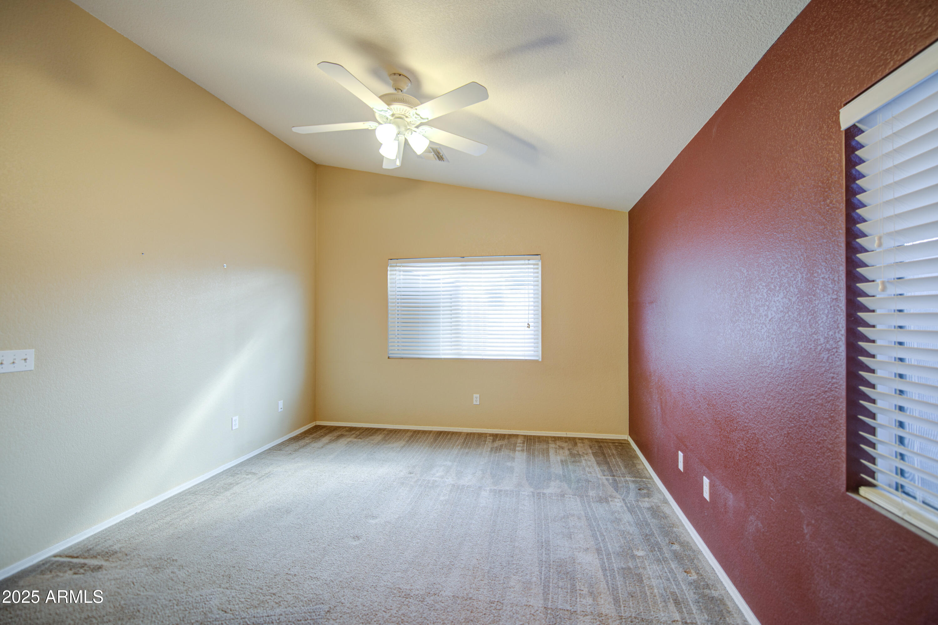 11465 East Cicero Street Mesa, AZ 85207 - Photo 19 of 36 a view of an empty room with wooden floor and a window