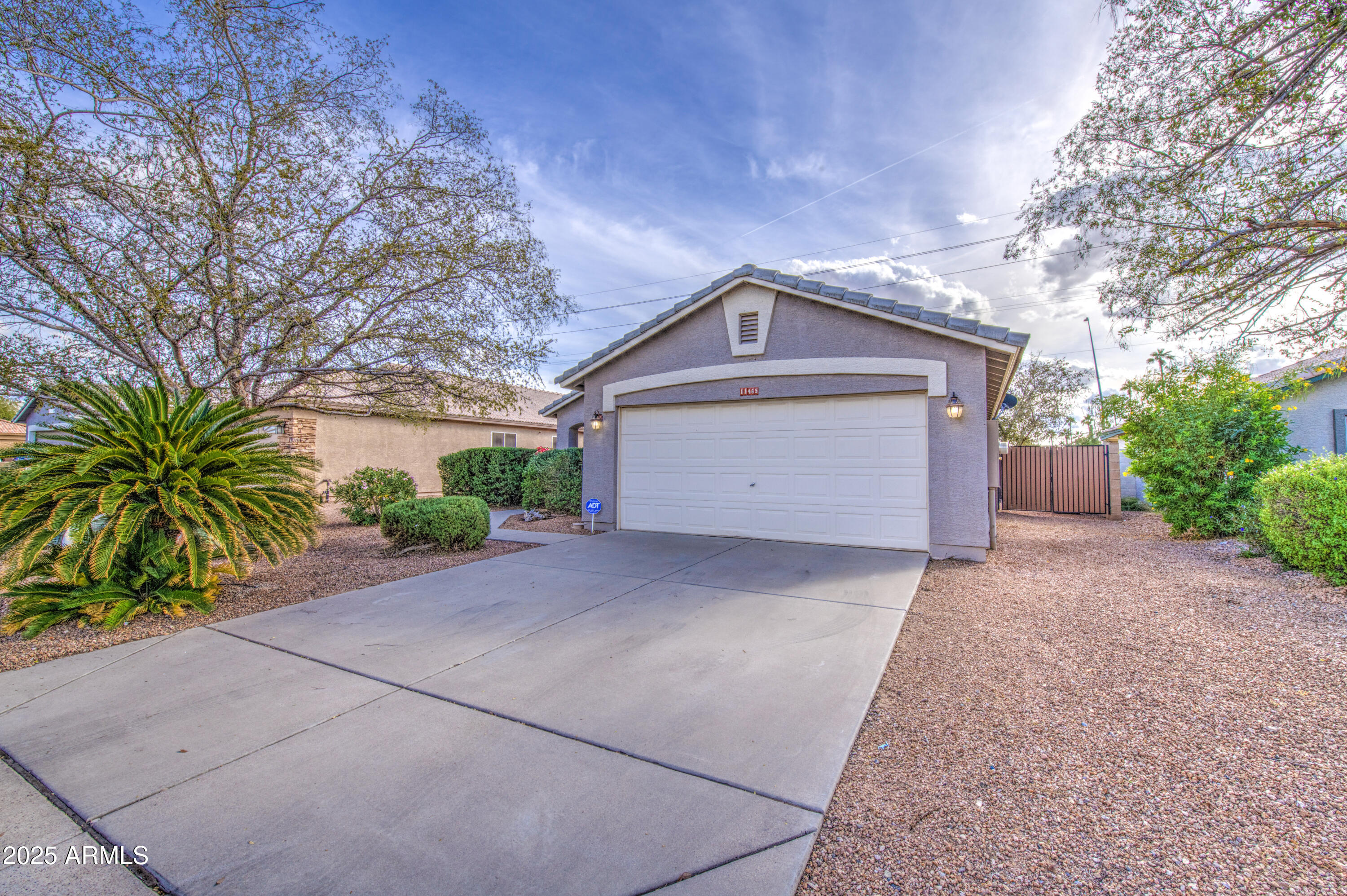 11465 East Cicero Street Mesa, AZ 85207 - Photo 2 of 36 a front view of a house with a yard and garage