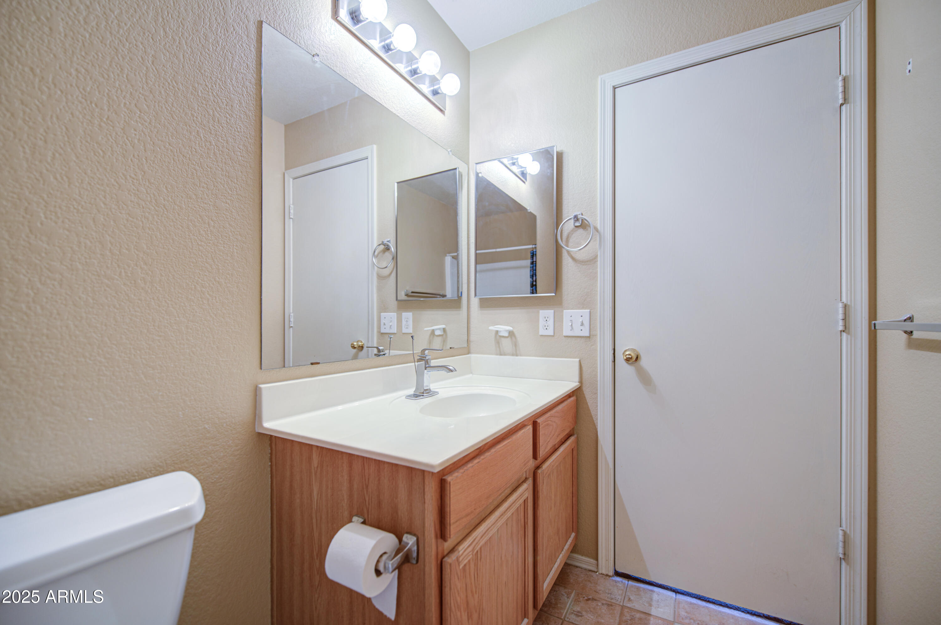 11465 East Cicero Street Mesa, AZ 85207 - Photo 23 of 36 a bathroom with a sink a toilet and mirror