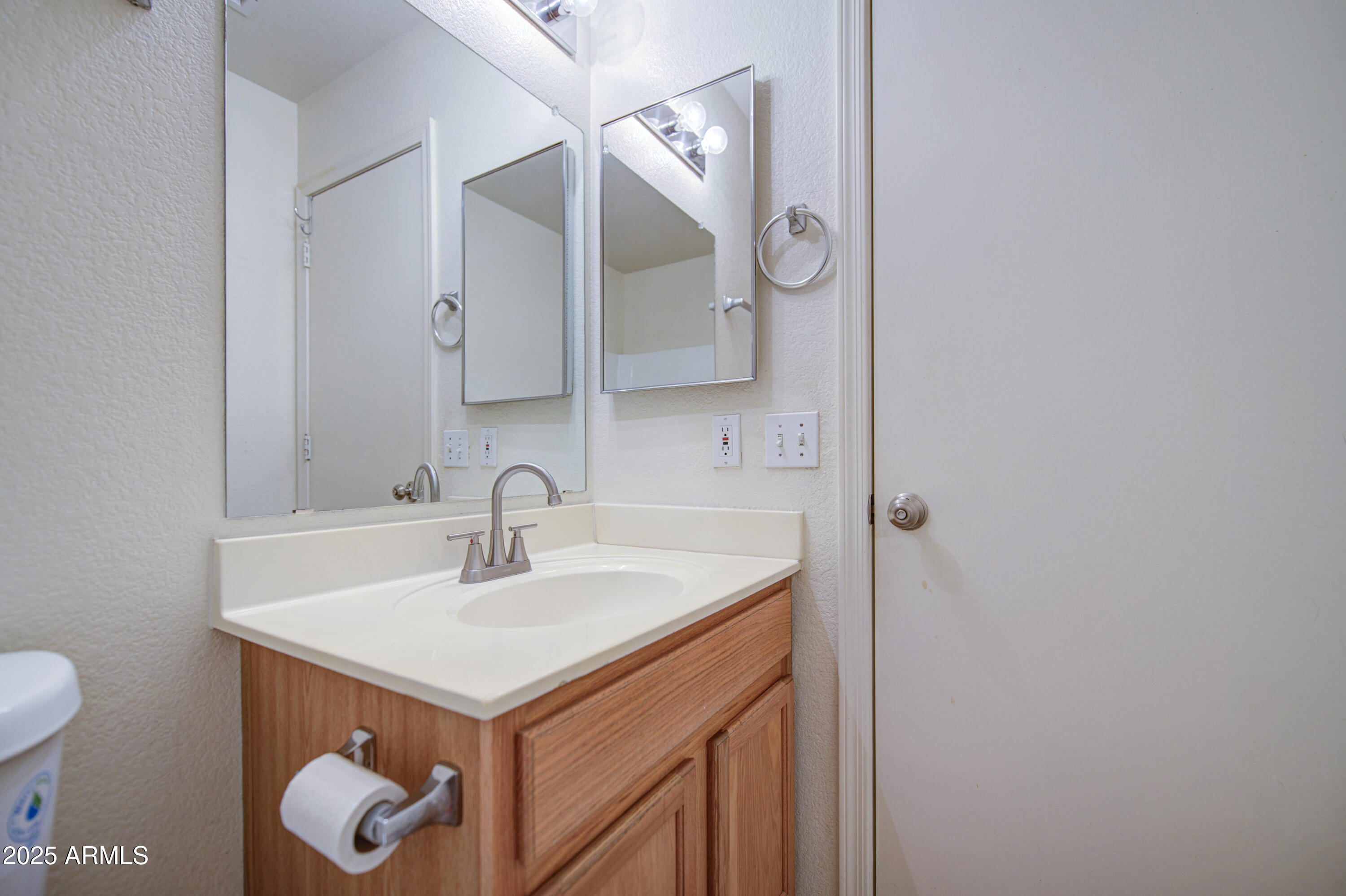 11465 East Cicero Street Mesa, AZ 85207 - Photo 29 of 36 a bathroom with a sink and a mirror