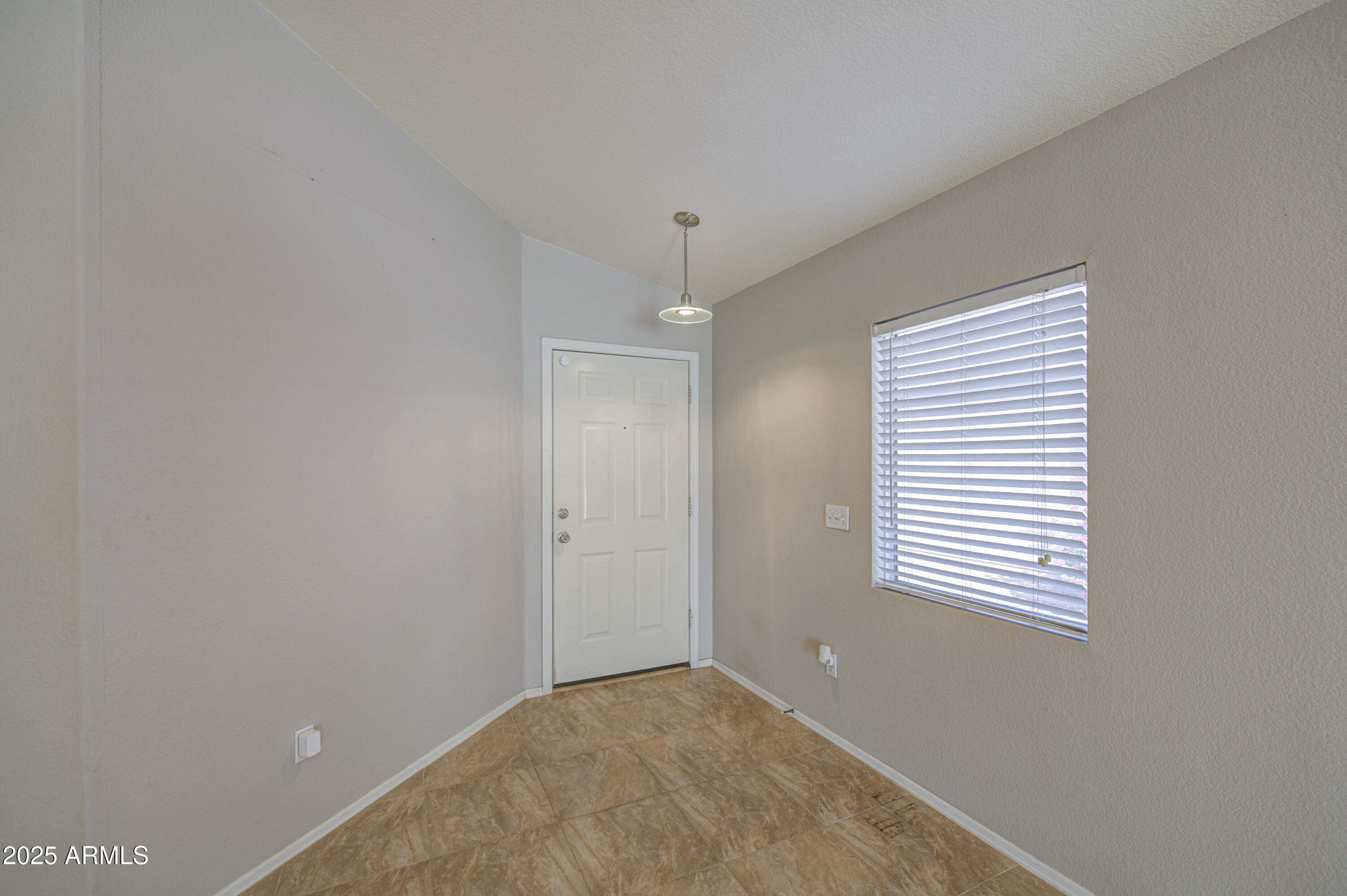 11465 East Cicero Street Mesa, AZ 85207 - Photo 5 of 36 a view of an empty room with a window
