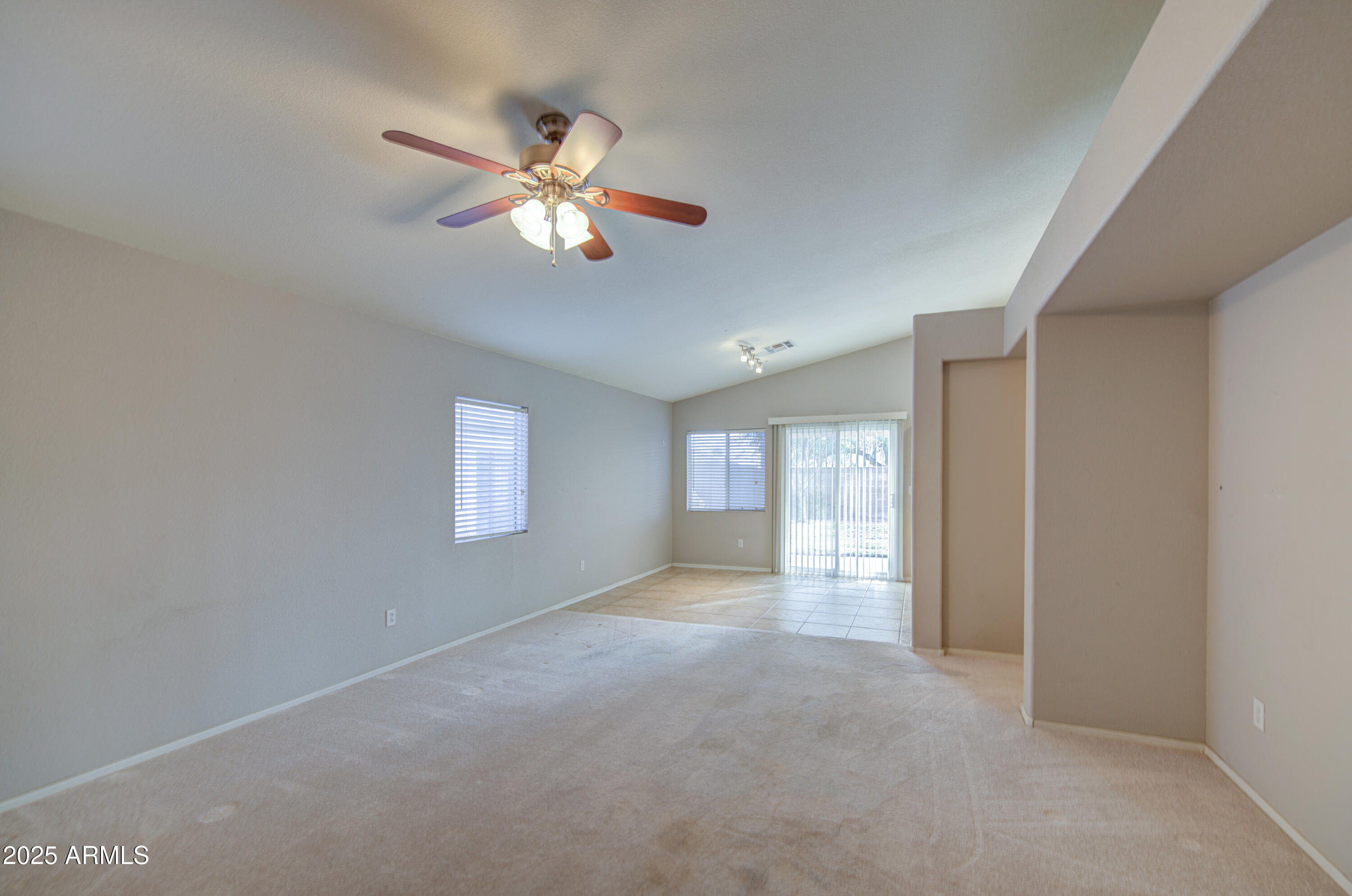 11465 East Cicero Street Mesa, AZ 85207 - Photo 6 of 36 a view of a livingroom with a ceiling fan and window