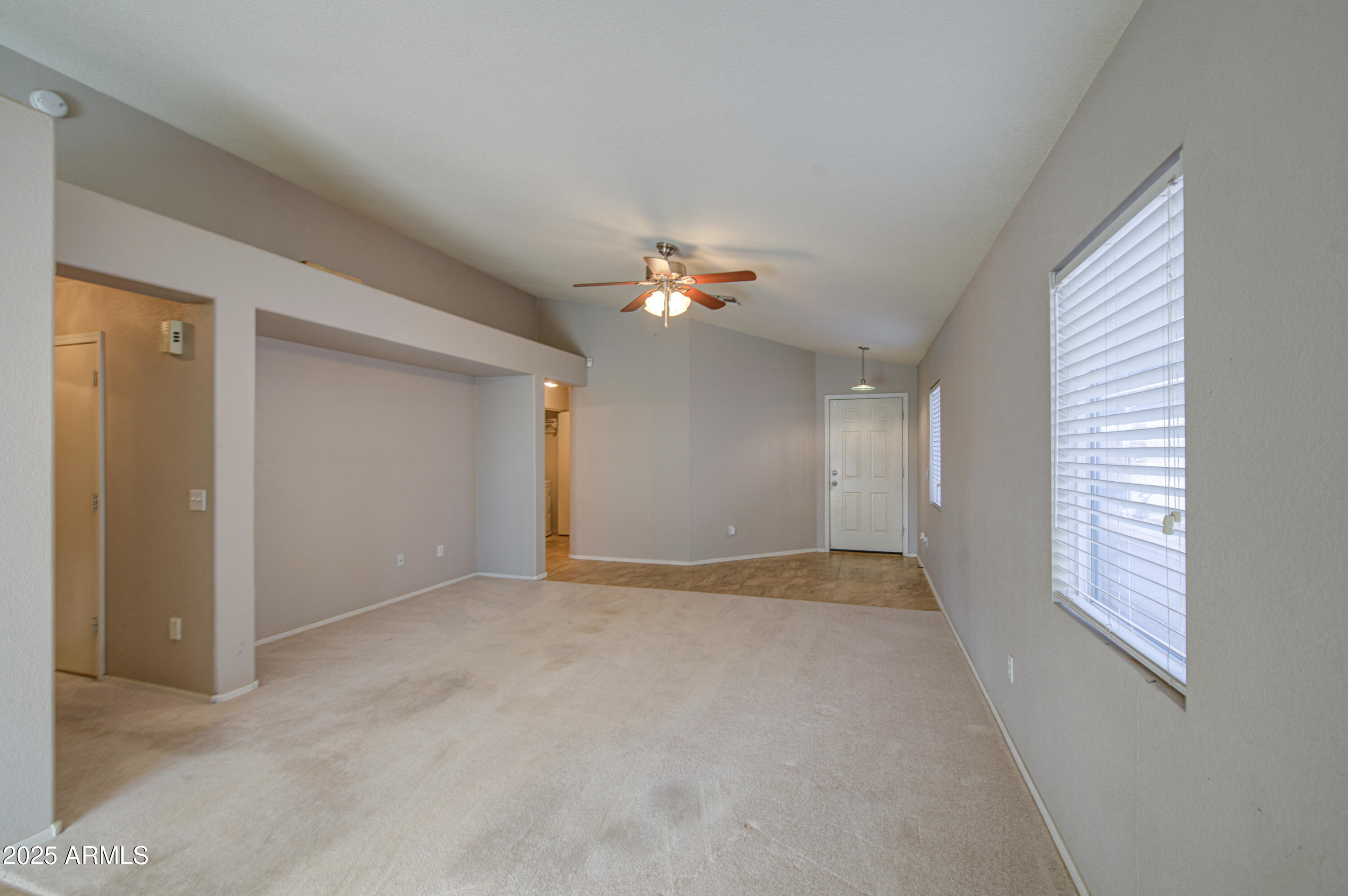 11465 East Cicero Street Mesa, AZ 85207 - Photo 8 of 36 a view of an empty room with a window