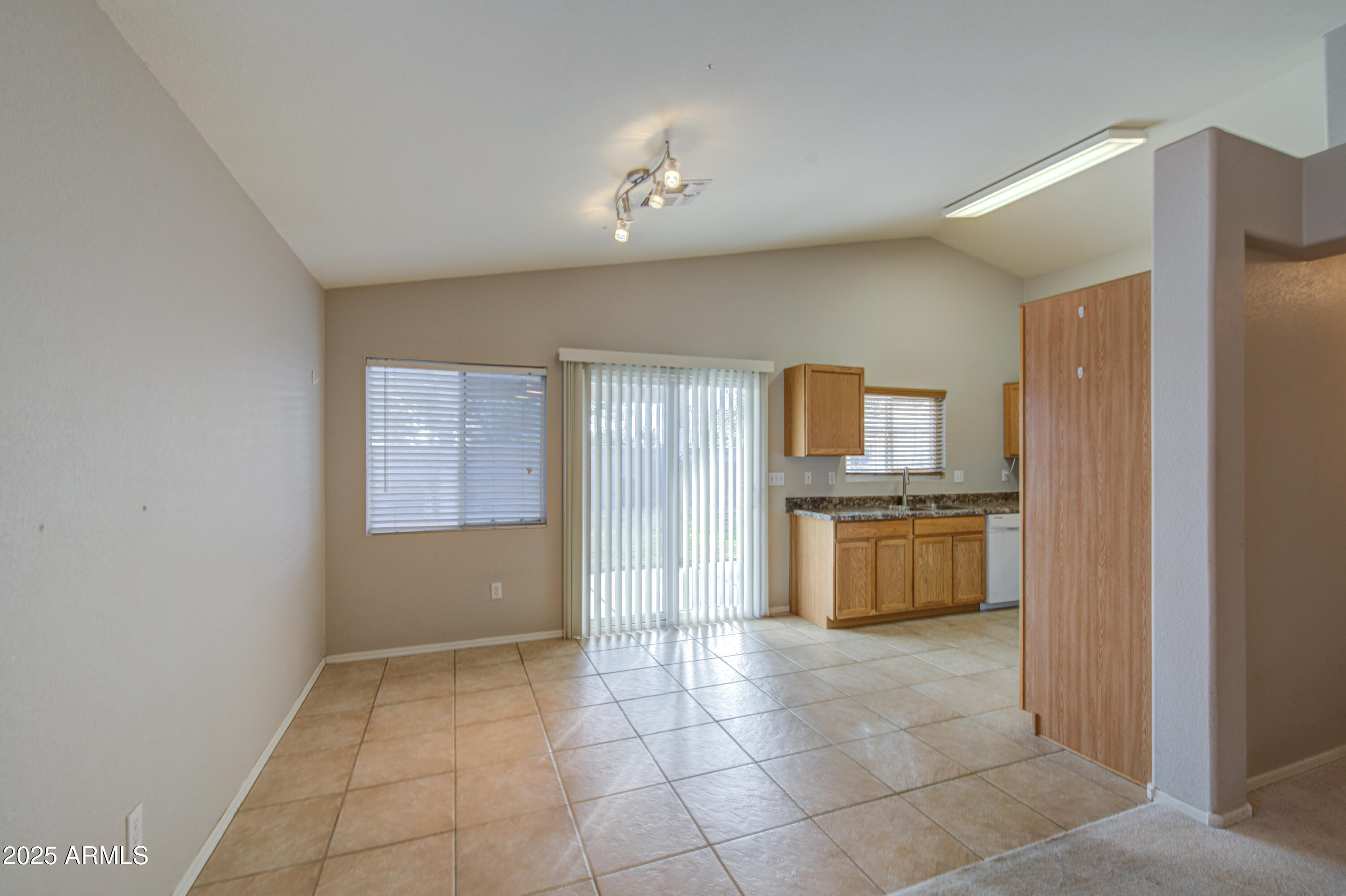 11465 East Cicero Street Mesa, AZ 85207 - Photo 10 of 36 a kitchen with stainless steel appliances granite countertop a refrigerator and a sink