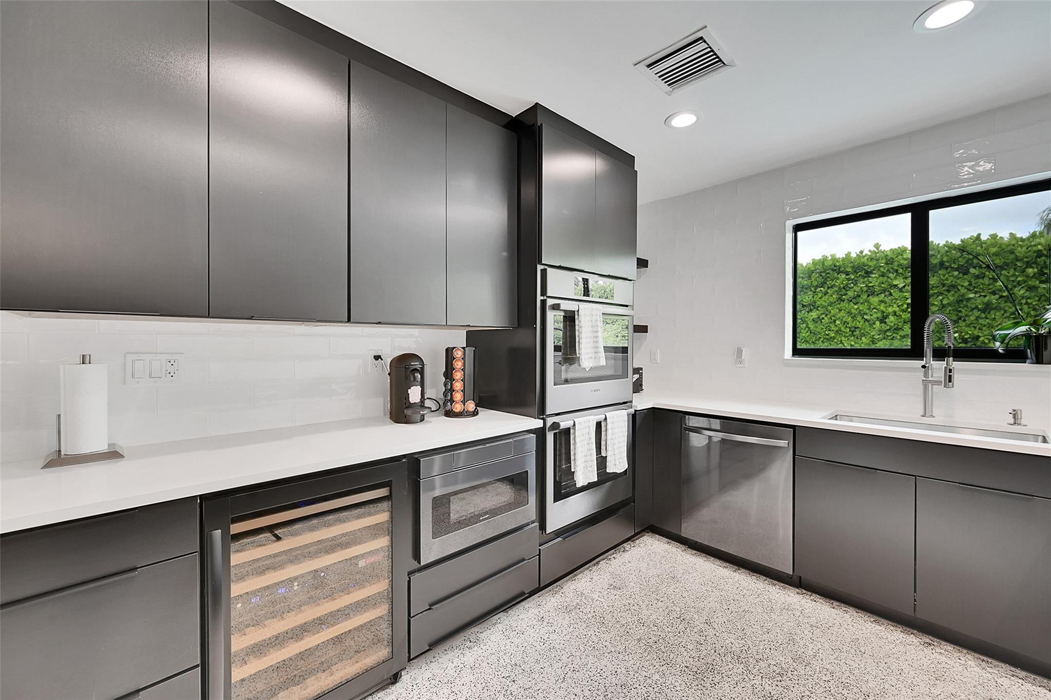 535 Northeast 113th Street Miami, FL 33161 - Photo 2 of 47 Open kitchen with a wine cooler.