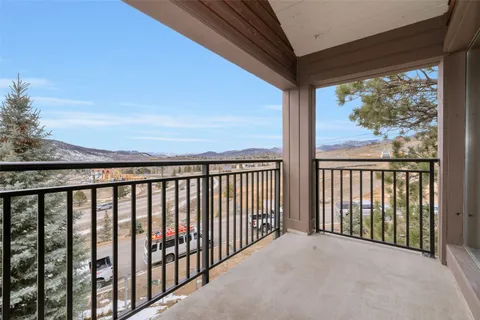 a view of a balcony with wooden floor