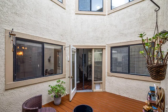 a potted plant sitting in front of a house