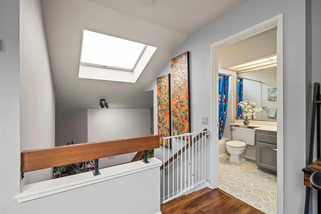a view of washer and dryer with wooden floor