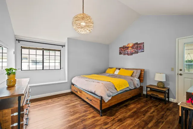 a bedroom with a bed and a table in it