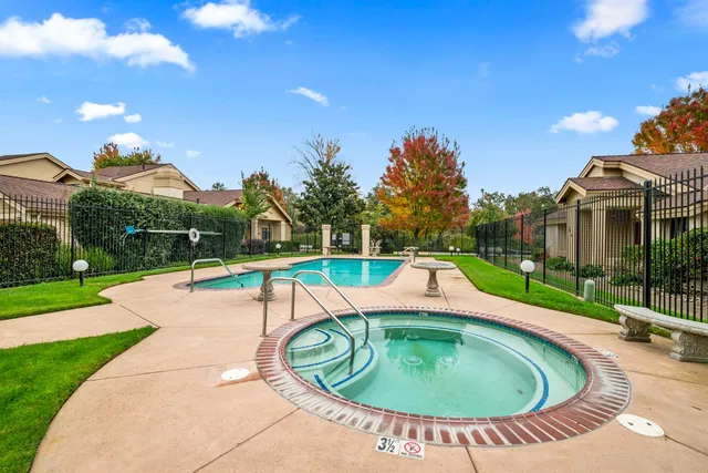 a view of a swimming pool with a patio