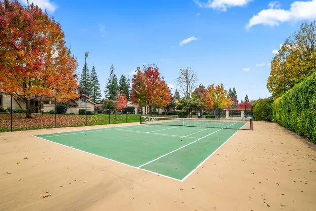 a sign that is sitting in front of flowers