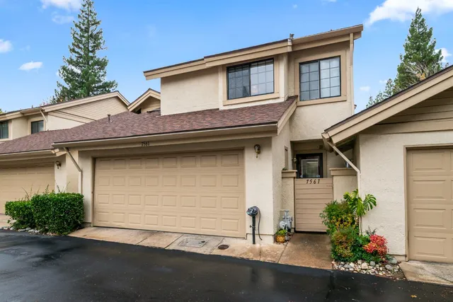 a front view of a house with a garage