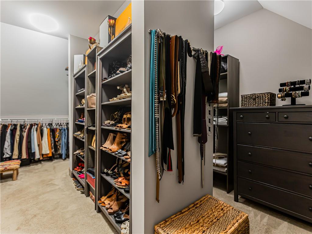 3820 Mabry Ridge Drive Buford, GA 30518 - Photo 33 of 55 a view of walk in closet with clothes and shoes