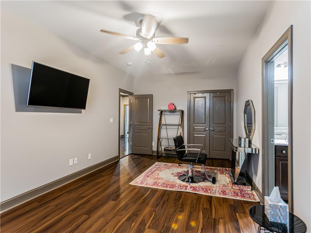 3820 Mabry Ridge Drive Buford, GA 30518 - Photo 35 of 55 a bedroom with a bed and a flat screen tv