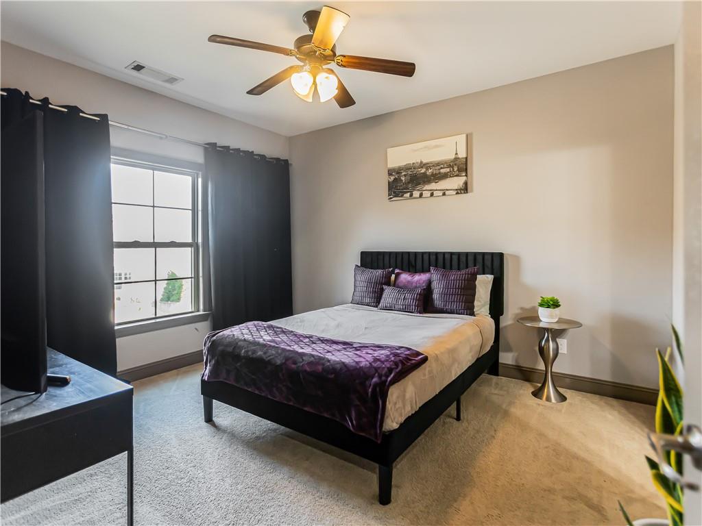 3820 Mabry Ridge Drive Buford, GA 30518 - Photo 37 of 55 a spacious bedroom with a bed and a window
