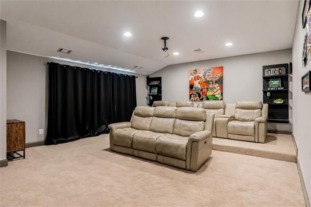 3820 Mabry Ridge Drive Buford, GA 30518 - Photo 41 of 55 a living room with furniture a projector and a projector