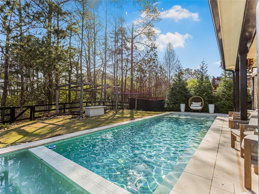3820 Mabry Ridge Drive Buford, GA 30518 - Photo 44 of 55 a view of yard with swimming pool and trees