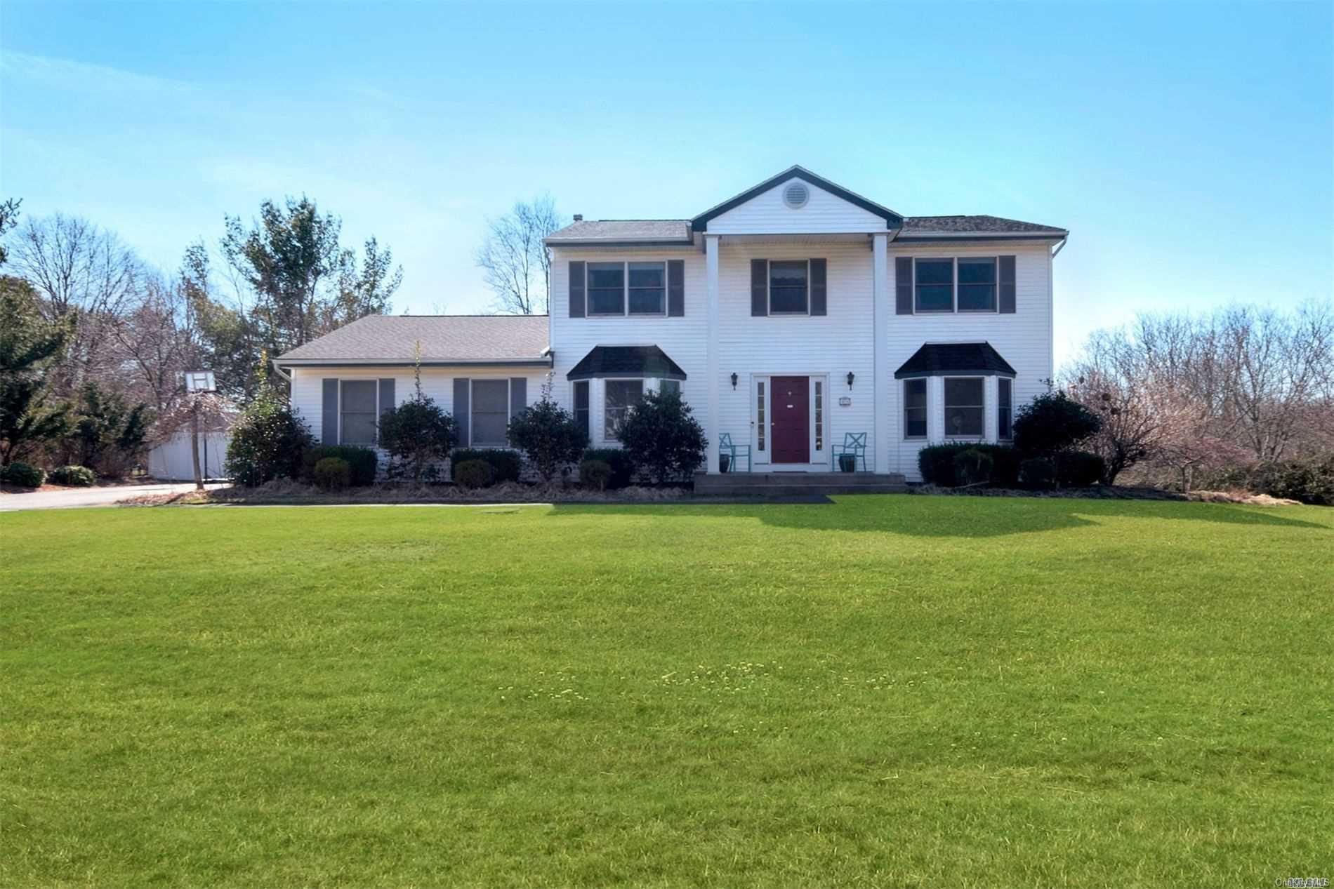 49 Elderwood Drive St. James, NY 11780 - Photo 1 of 1 a front view of a house with a yard