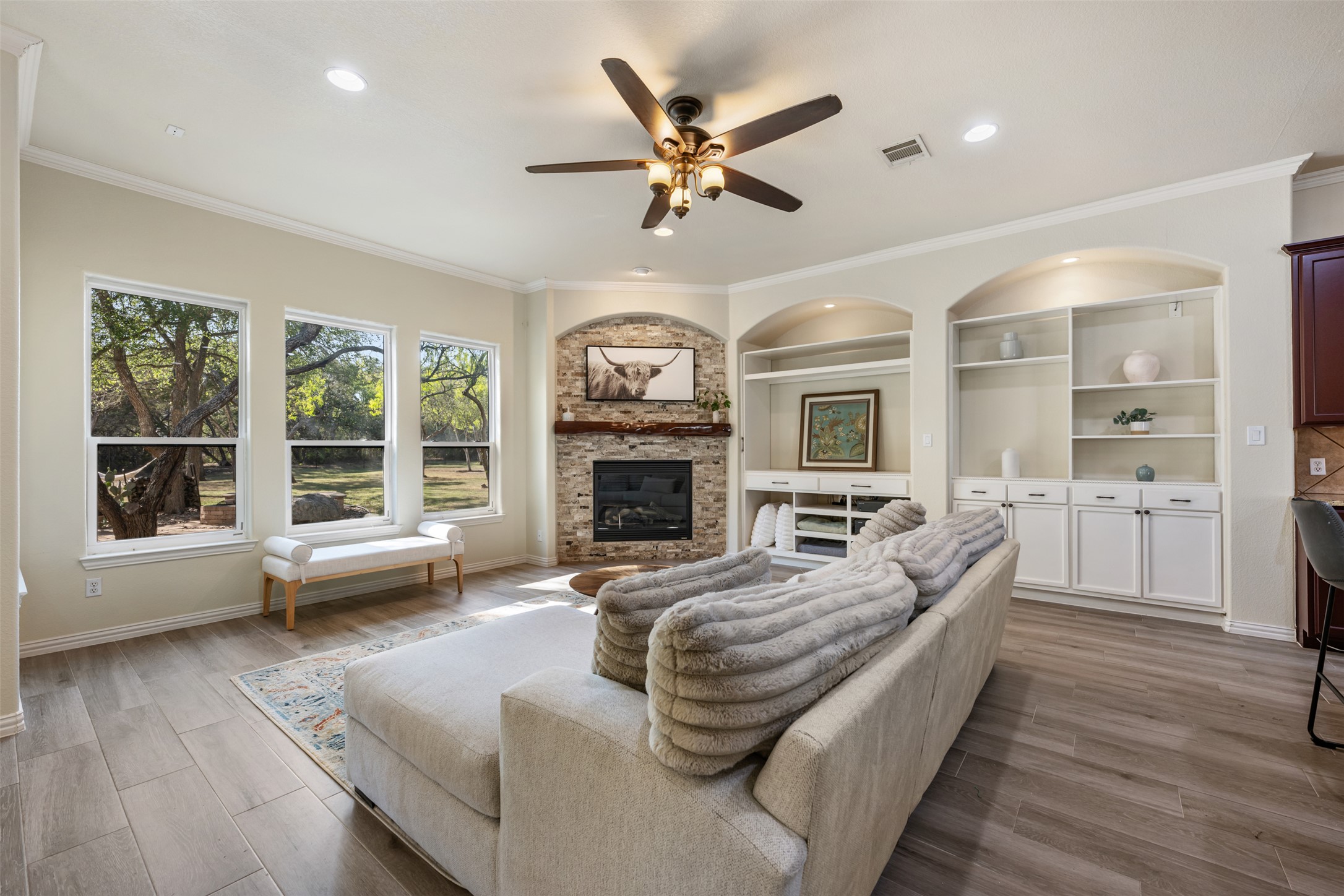 181 Whitney Run Buda, TX 78610 - Photo 10 of 40 Gorgeous living room with built-ins & custom rock fireplaces.