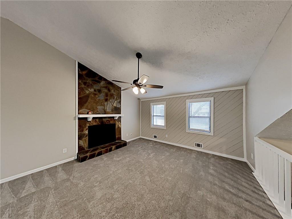 3548 Cherokee Overlook Drive Canton, GA 30115 - Photo 14 of 24 an empty room with windows and fireplace