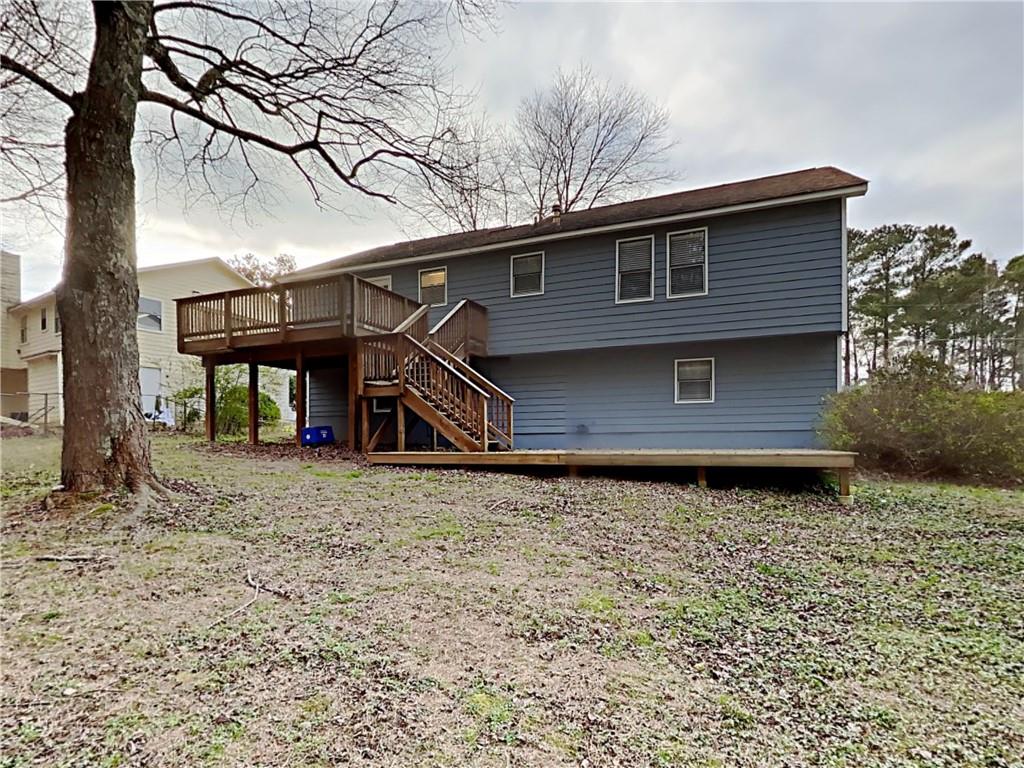 3548 Cherokee Overlook Drive Canton, GA 30115 - Photo 2 of 24 a front view of a house with a yard