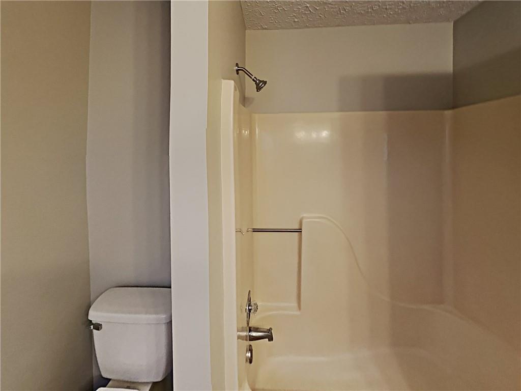 3548 Cherokee Overlook Drive Canton, GA 30115 - Photo 22 of 24 a bathroom with a toilet and a shower