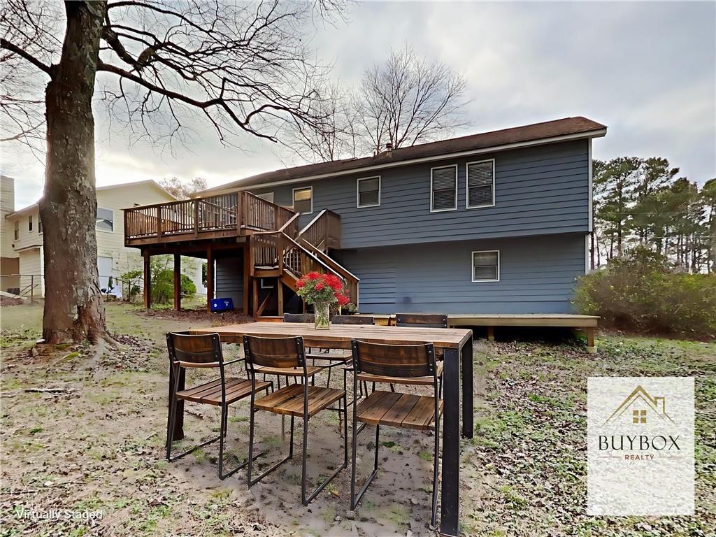 3548 Cherokee Overlook Drive Canton, GA 30115 - Photo 24 of 24 a view of a chairs and table in the backyard
