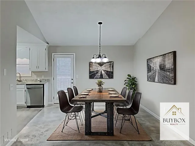 a dining room with furniture and window