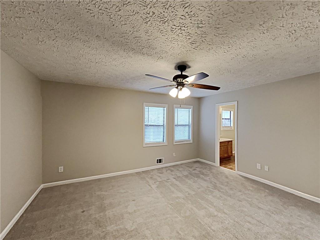 3548 Cherokee Overlook Drive Canton, GA 30115 - Photo 7 of 24 a view of an empty room with a window