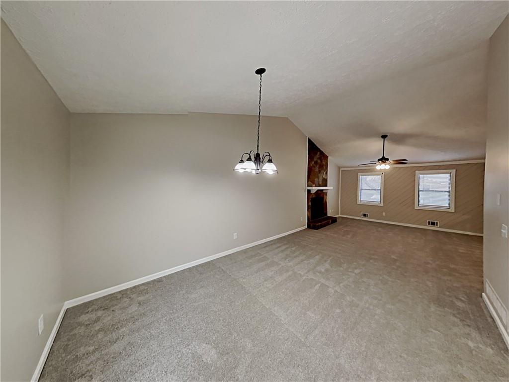 3548 Cherokee Overlook Drive Canton, GA 30115 - Photo 9 of 24 a view of a room with a ceiling fan and window