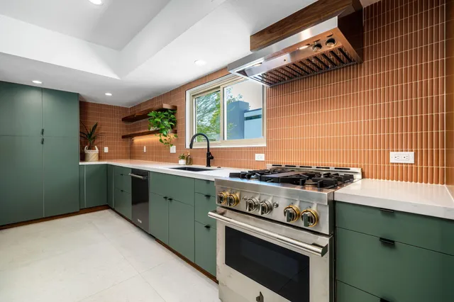 a kitchen with a stove and a sink