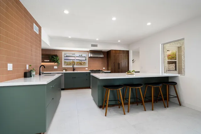 a kitchen with counter top space and appliances