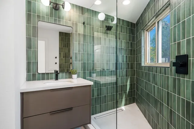 a bathroom with a sink and a mirror