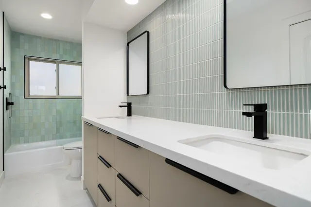 a bathroom with a sink and a shower