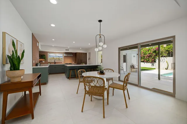 a view of a dining room with furniture window and outside view