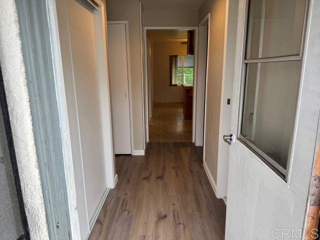8762 Tyler Street, Unit A Spring Valley, CA 91977 - Photo 12 of 28 a view of a hallway with wooden floor