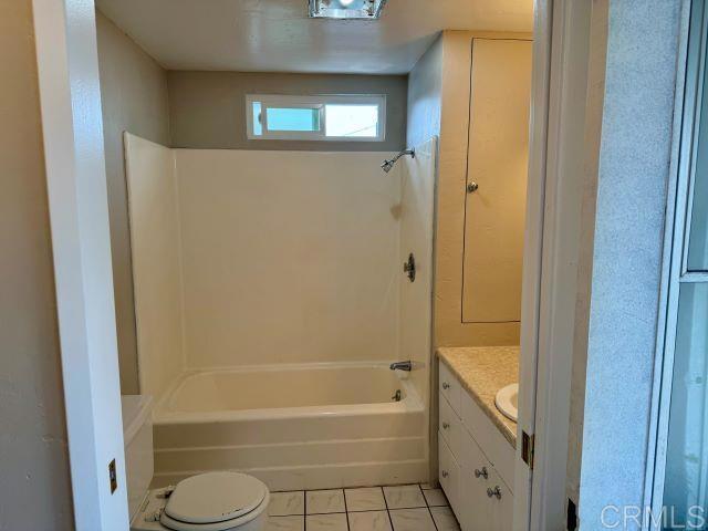 8762 Tyler Street, Unit A Spring Valley, CA 91977 - Photo 14 of 28 a bathroom with a granite countertop bathtub shower and toilet