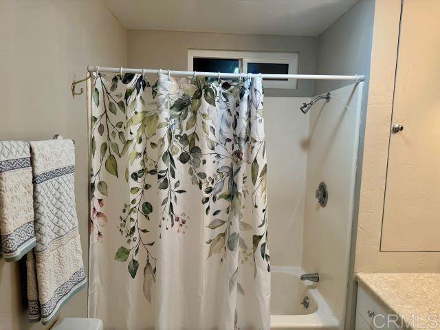 8762 Tyler Street, Unit A Spring Valley, CA 91977 - Photo 15 of 28 a bathroom with a shower and a sink