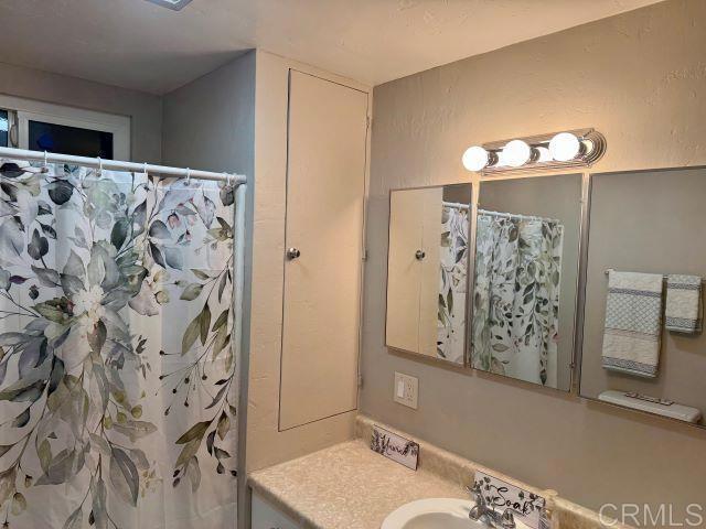 8762 Tyler Street, Unit A Spring Valley, CA 91977 - Photo 16 of 28 a bathroom with a bathtub and shower
