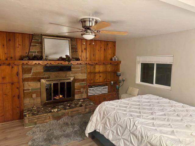 8762 Tyler Street, Unit A Spring Valley, CA 91977 - Photo 22 of 28 a bedroom with a bed and a fireplace