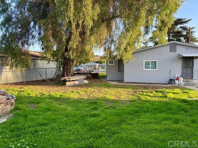8762 Tyler Street, Unit A Spring Valley, CA 91977 - Photo 23 of 28 a view of a house with a yard