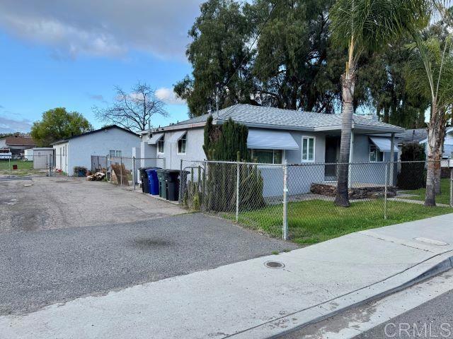 8762 Tyler Street, Unit A Spring Valley, CA 91977 - Photo 27 of 28 a view of a house with a yard and large tree
