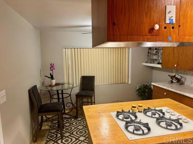 8762 Tyler Street, Unit A Spring Valley, CA 91977 - Photo 5 of 28 a bedroom with a bed and a table in it