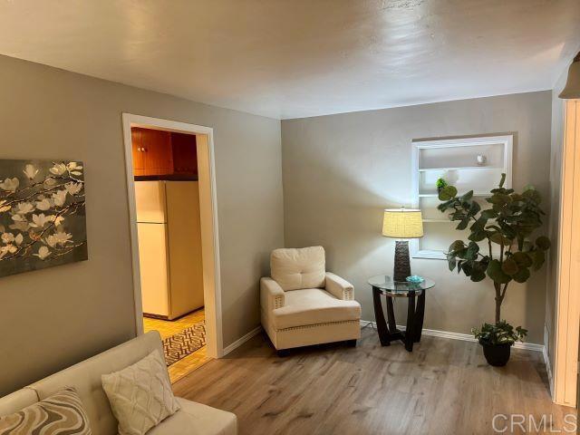 8762 Tyler Street, Unit A Spring Valley, CA 91977 - Photo 7 of 28 a living room with furniture and a potted plant